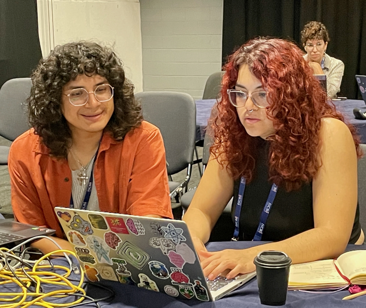 Dorian and Alejandra pair programming on the README comparisons.